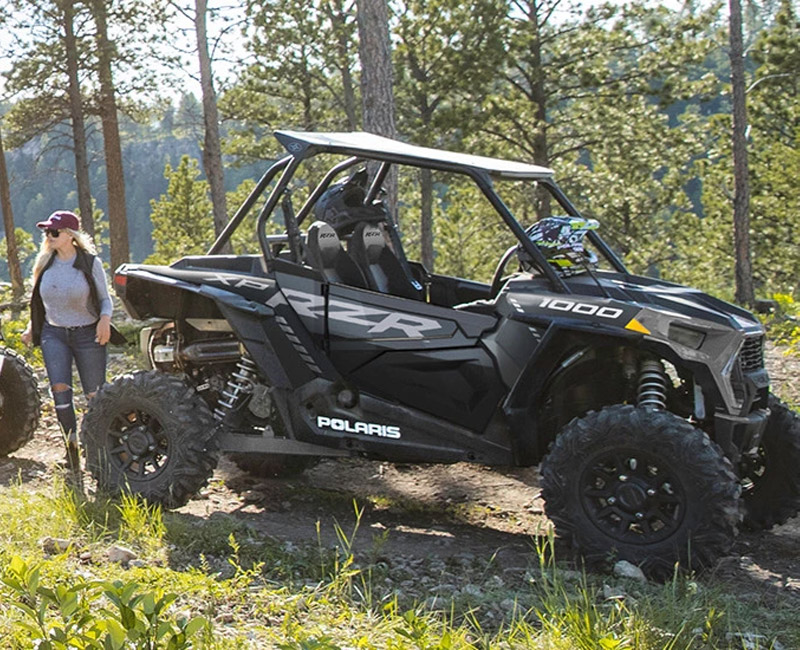 Polaris® RZR crusing through a forest