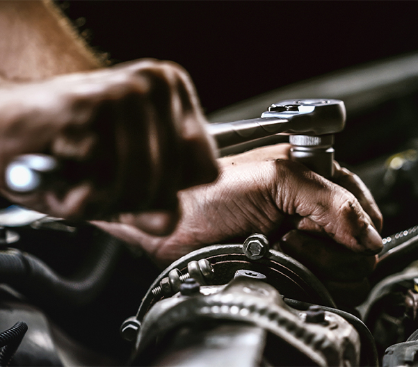 Service tech fixing a transmission